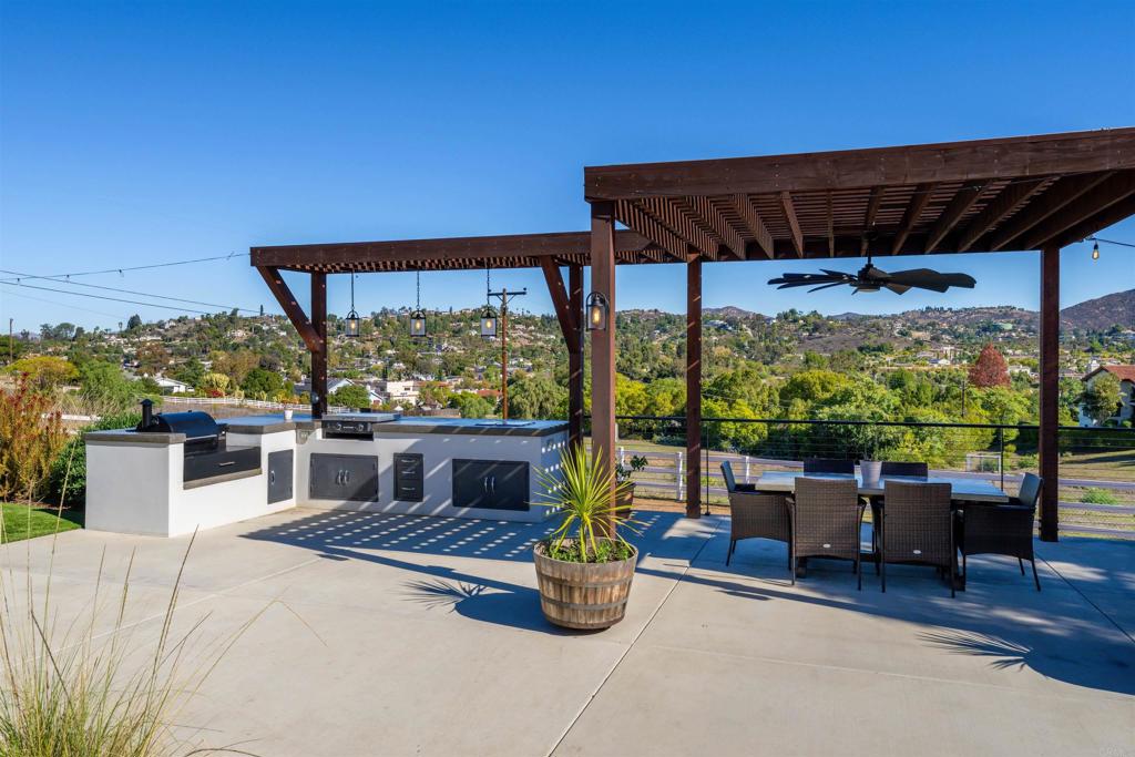 1358 Sundale Road El Cajon, CA 92019 - Photo 17 of 25 a view of porch with a table and chairs under an umbrella