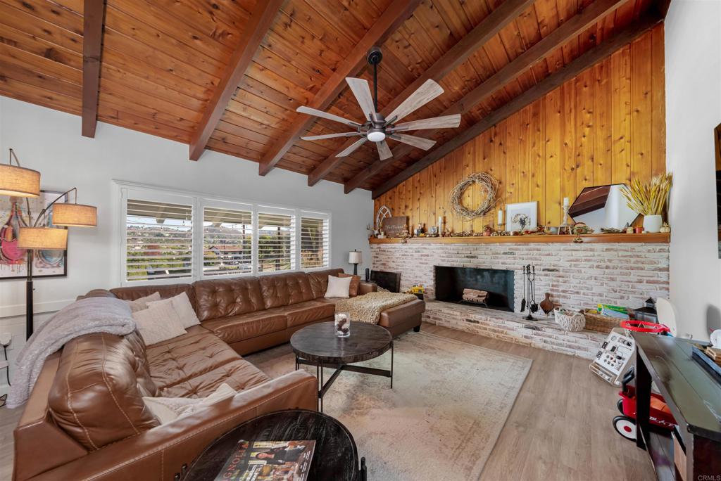 1358 Sundale Road El Cajon, CA 92019 - Photo 2 of 25 a living room with furniture a fireplace and a table