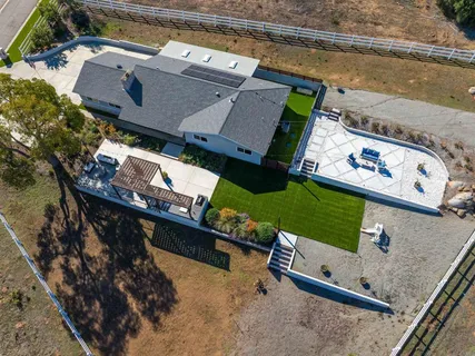 an aerial view of a house with a ocean view