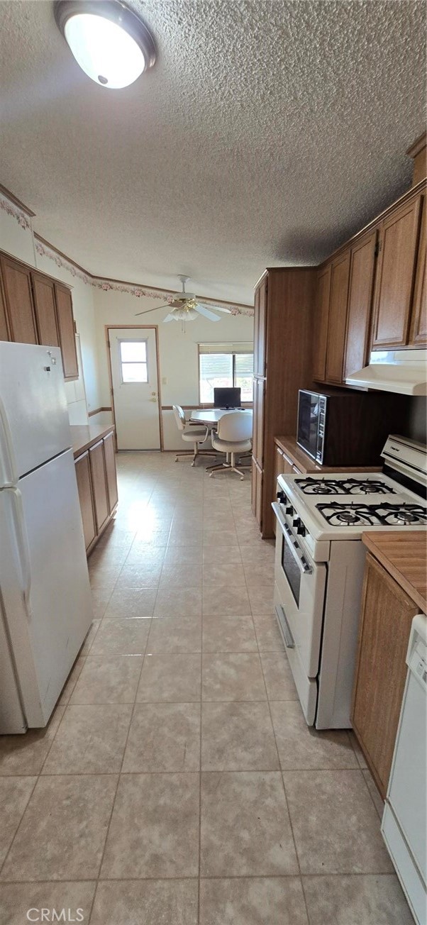 90 3rd Orland, CA 95963 - Photo 12 of 17 a kitchen with a sink a stove and cabinets