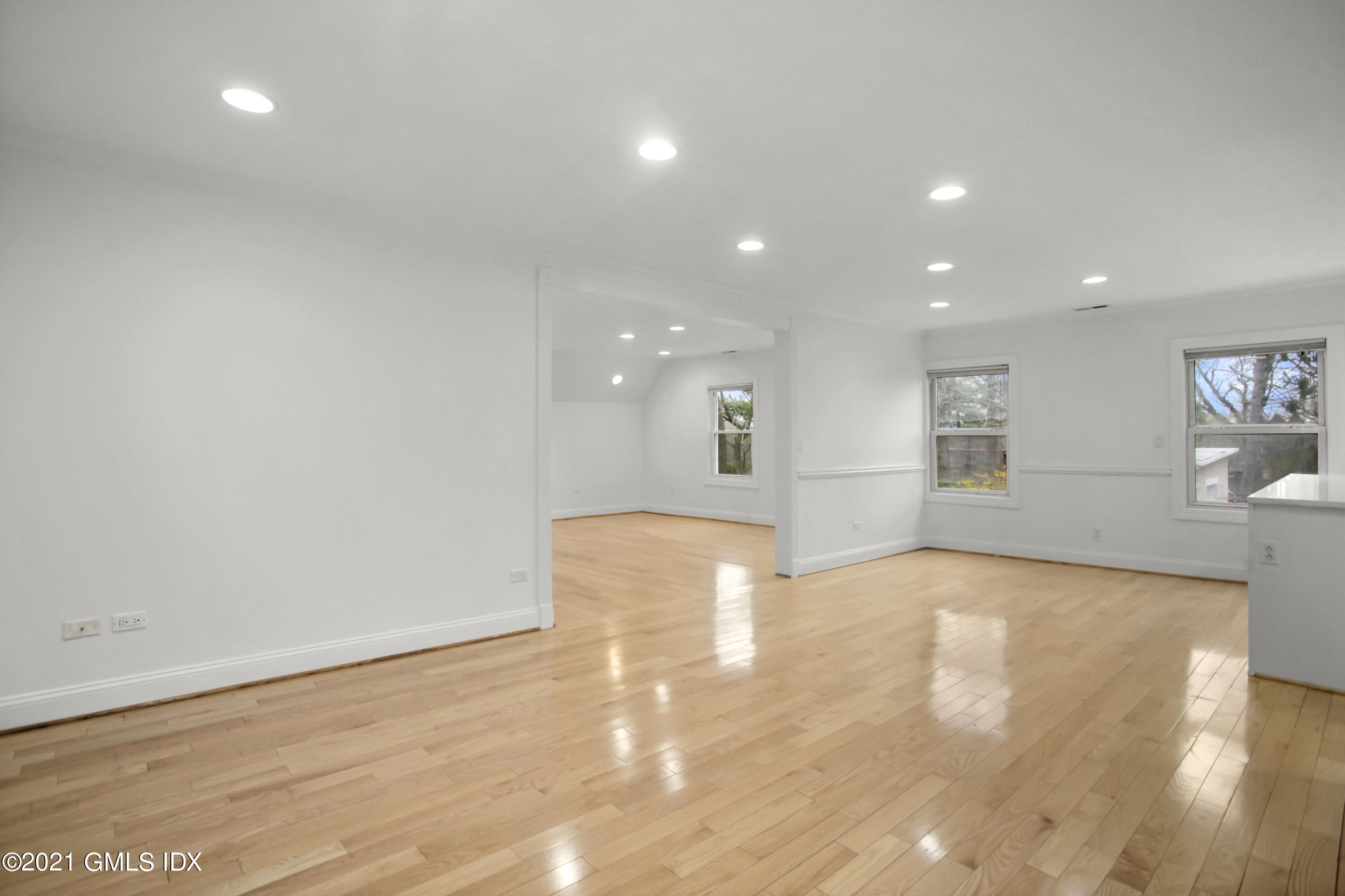 52 Bruce Park Drive, Unit B Greenwich, CT 06830 - Photo 3 of 20 a view of an empty room with wooden floor