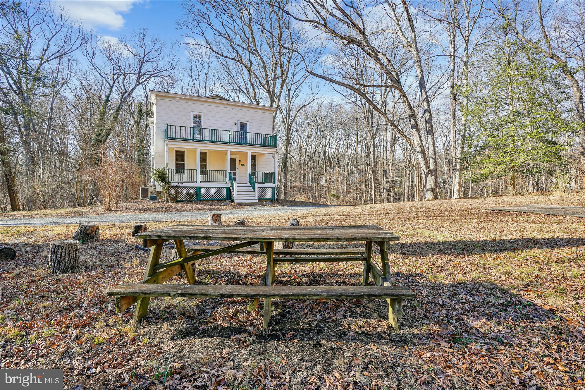 2799 Beechbank Road Silver Spring, MD 20910 - Photo 2 of 42 a view of a bench sitting in the middle of a yard