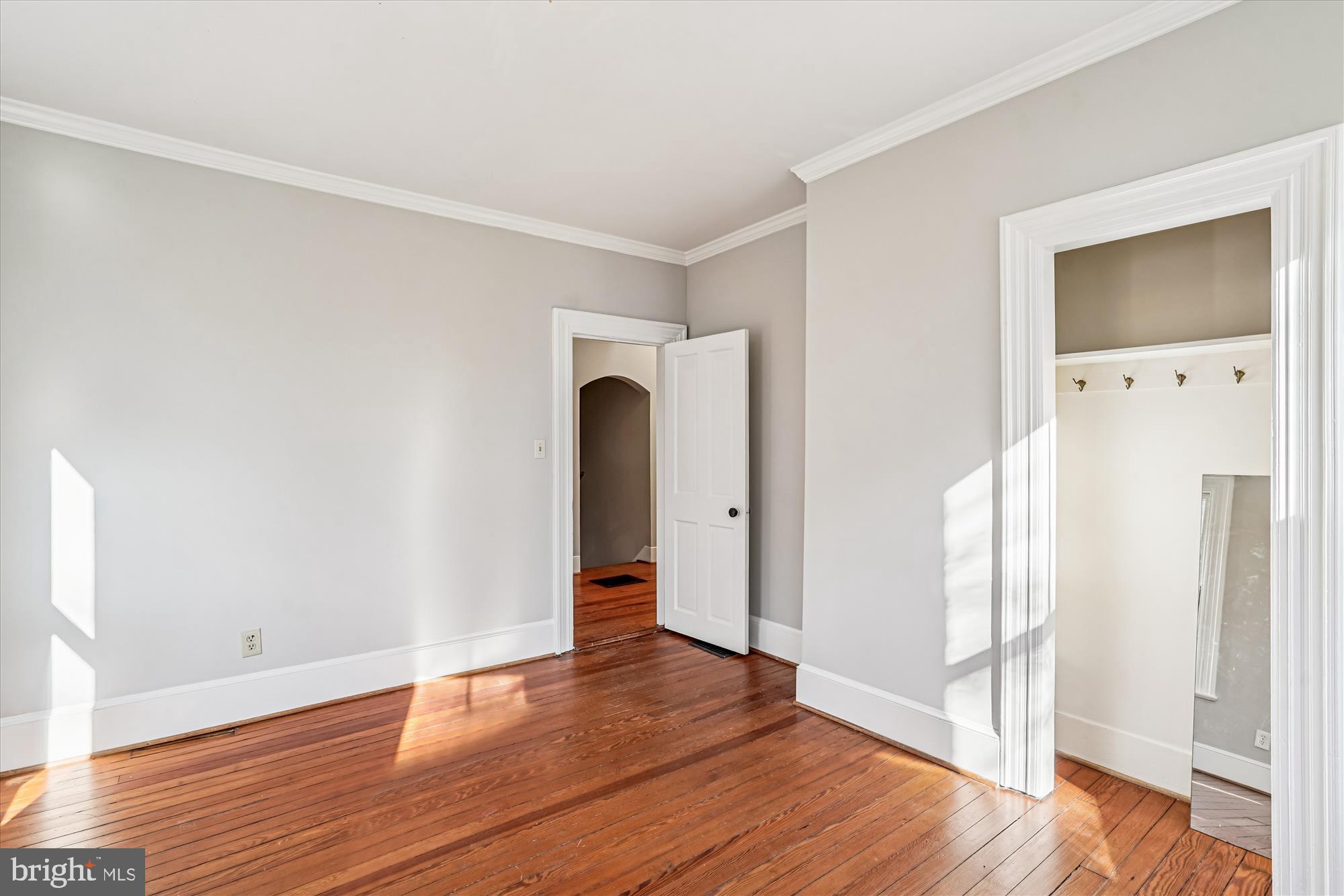 2799 Beechbank Road Silver Spring, MD 20910 - Photo 22 of 42 a view of an empty room with wooden floor and a window