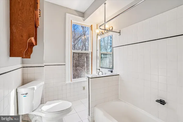 a bathroom with a toilet and shower