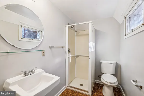 a bathroom with a toilet sink and a shower