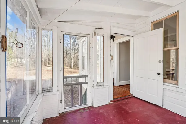 a view of a bathroom with a glass door shower