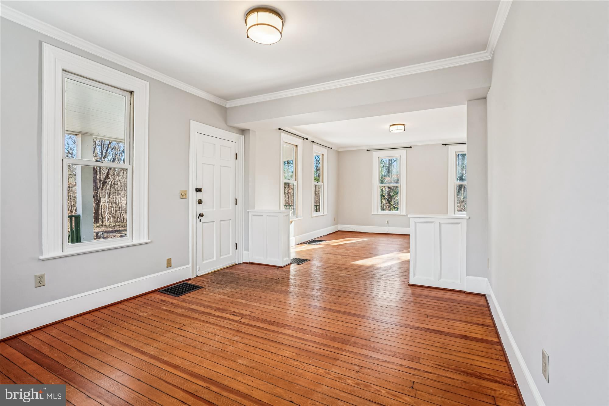 2799 Beechbank Road Silver Spring, MD 20910 - Photo 9 of 42 an empty room with wooden floor and windows