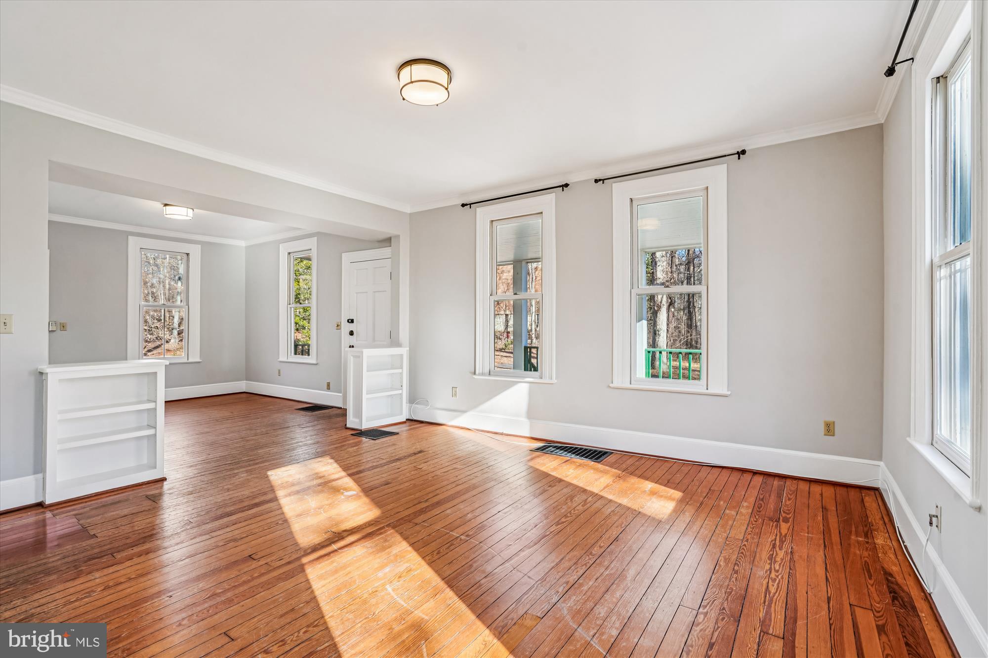 2799 Beechbank Road Silver Spring, MD 20910 - Photo 10 of 42 a view of an empty room with wooden floor and a window