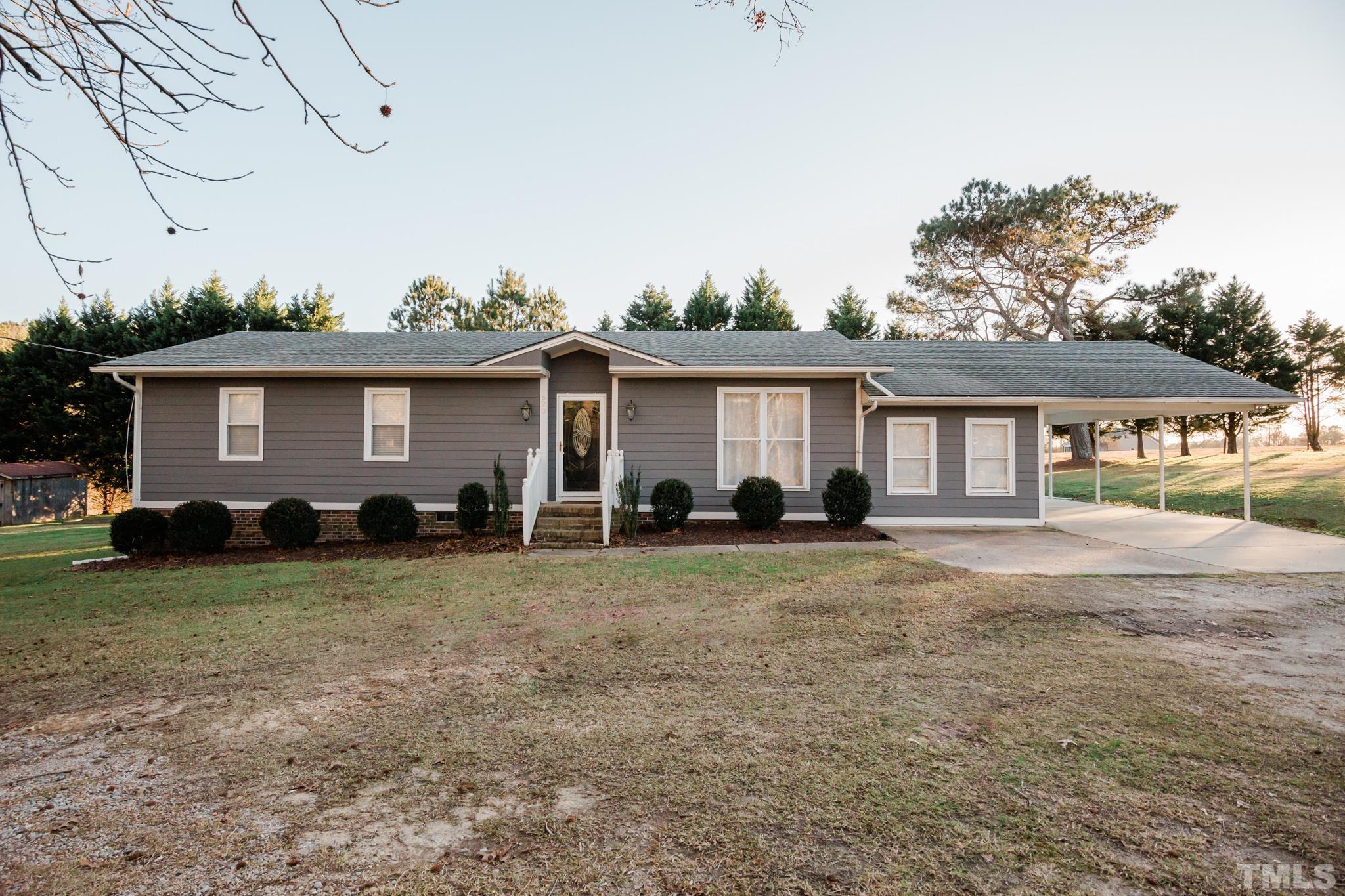 623 Little Creek Church Road Clayton, NC 27520 - Photo 1 of 47 a view of a house with backyard and a tree