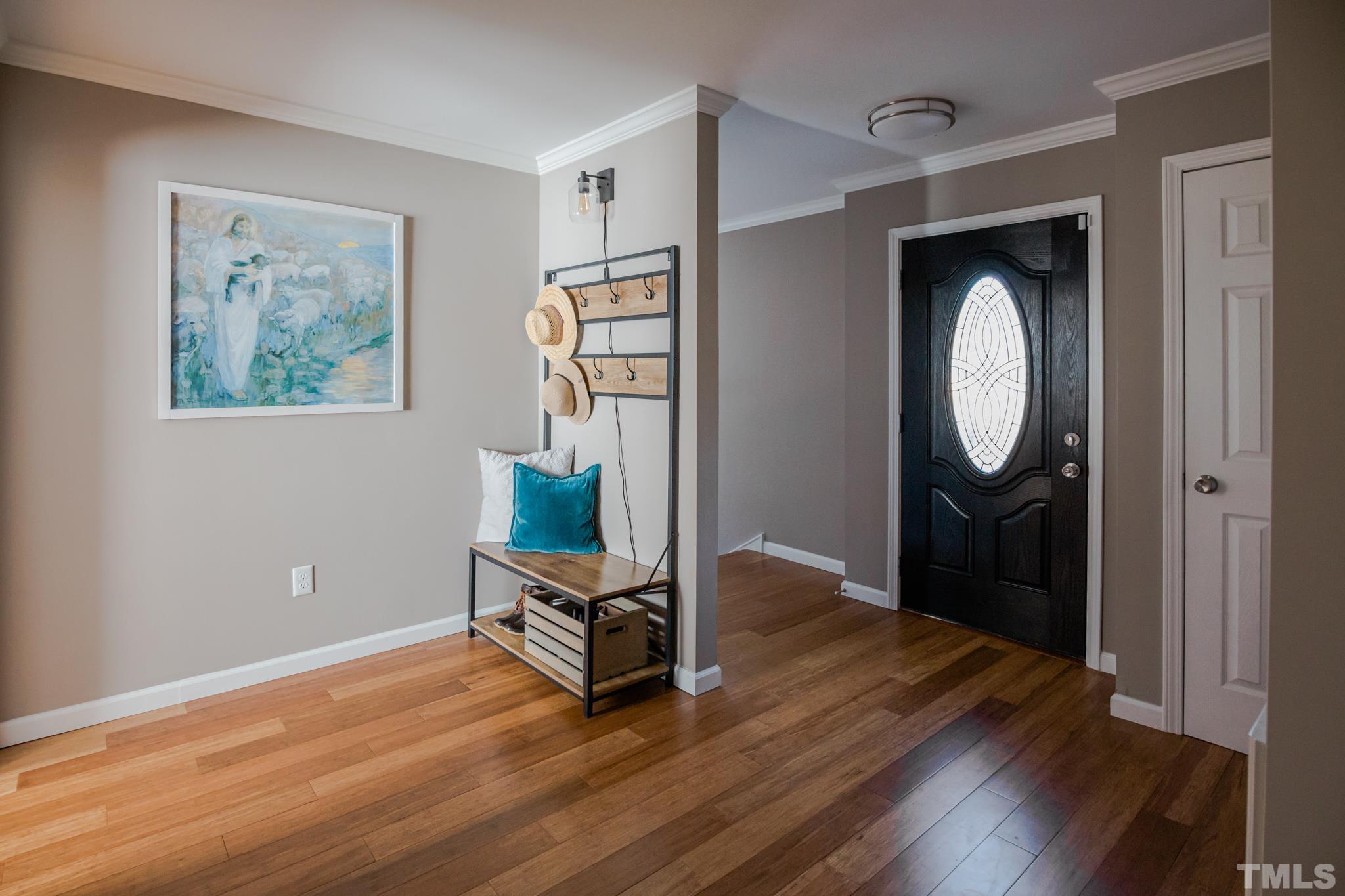623 Little Creek Church Road Clayton, NC 27520 - Photo 11 of 47 a room with painting and a wooden floor