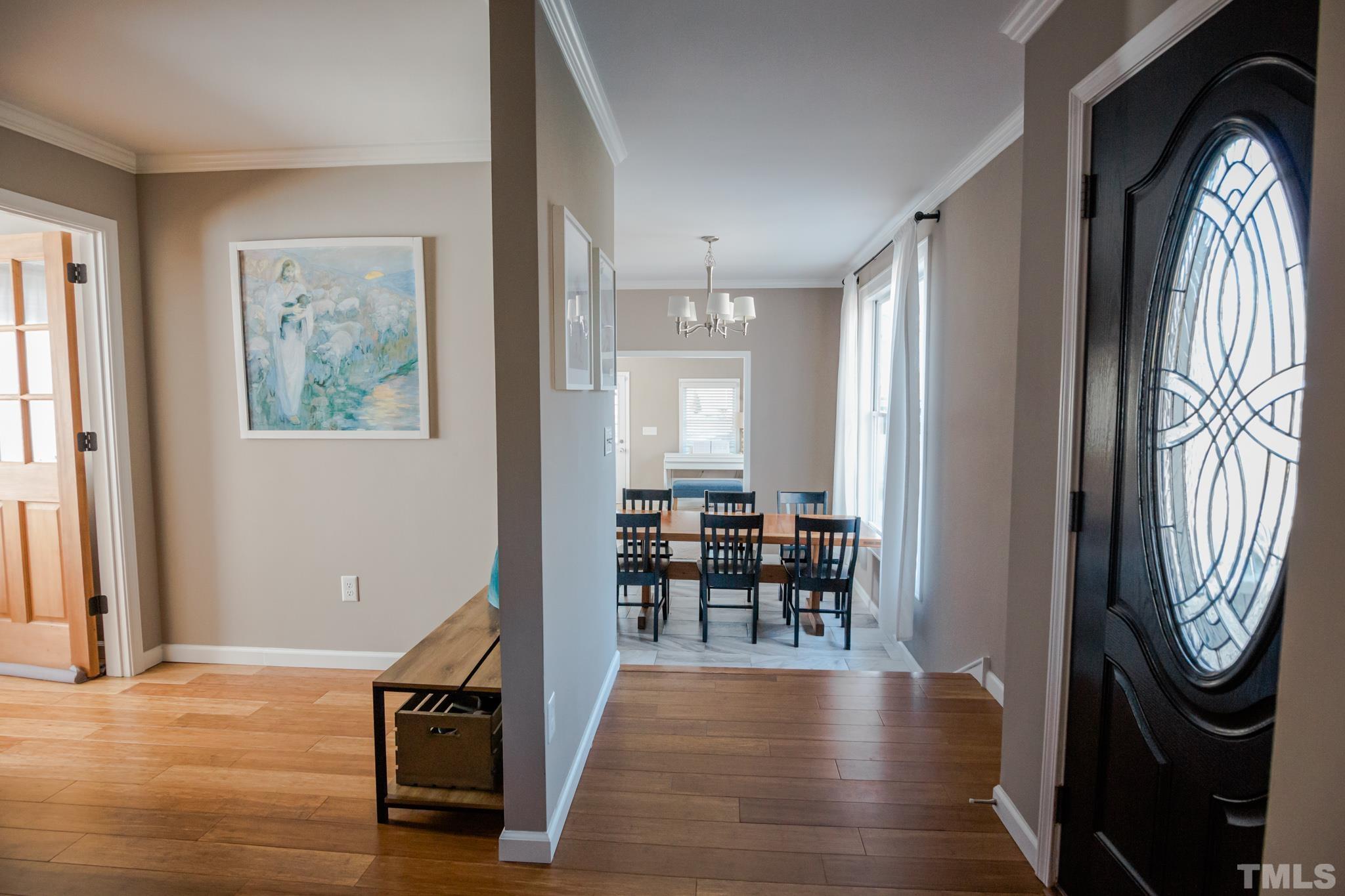 623 Little Creek Church Road Clayton, NC 27520 - Photo 13 of 47 a view of a livingroom with furniture and wooden floor