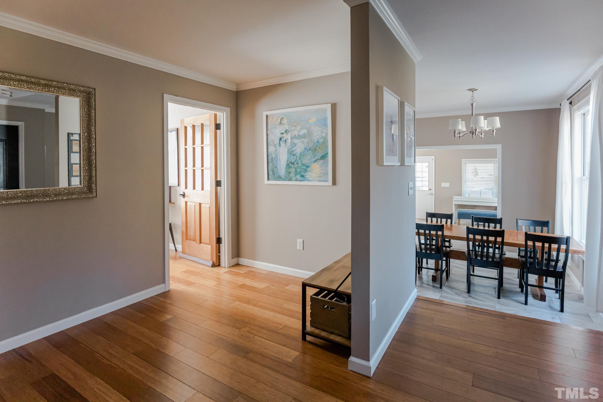 623 Little Creek Church Road Clayton, NC 27520 - Photo 14 of 47 a view of a livingroom with furniture window and wooden floor