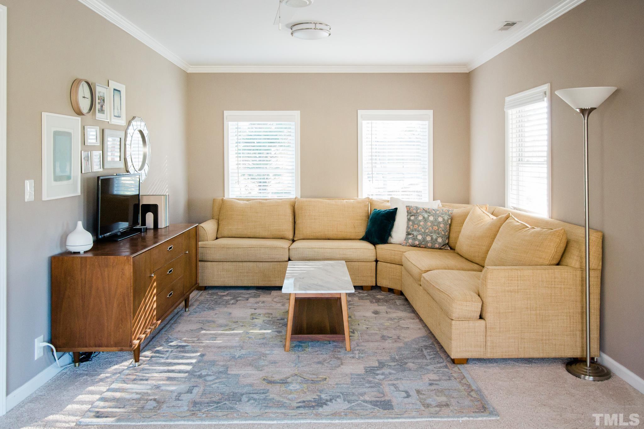 623 Little Creek Church Road Clayton, NC 27520 - Photo 15 of 47 a living room with furniture and a window