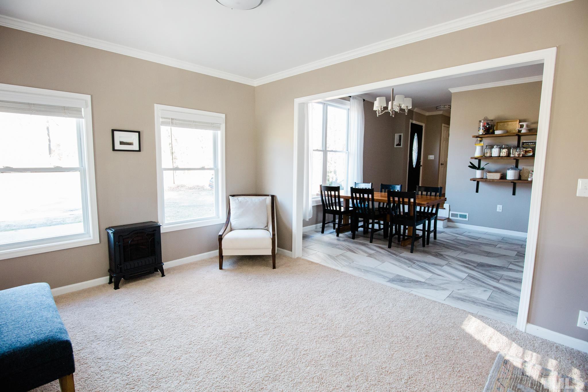 623 Little Creek Church Road Clayton, NC 27520 - Photo 18 of 47 a living room with furniture and a window