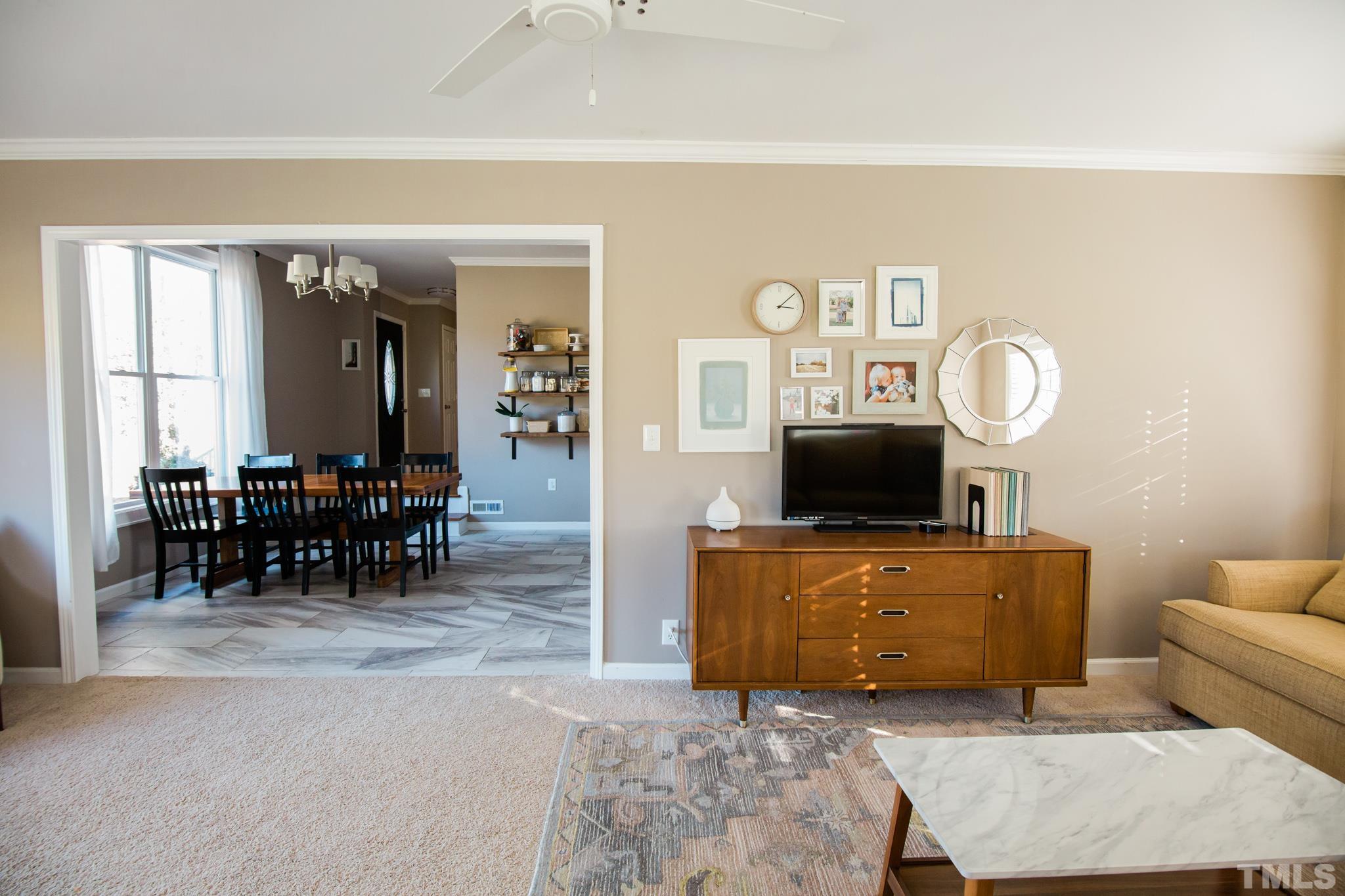 623 Little Creek Church Road Clayton, NC 27520 - Photo 19 of 47 a living room with furniture and a table
