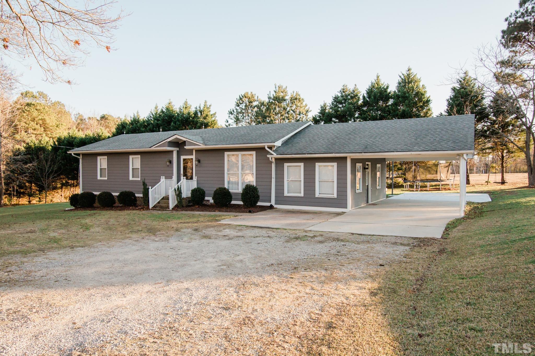 623 Little Creek Church Road Clayton, NC 27520 - Photo 2 of 47 a front view of a house with a yard