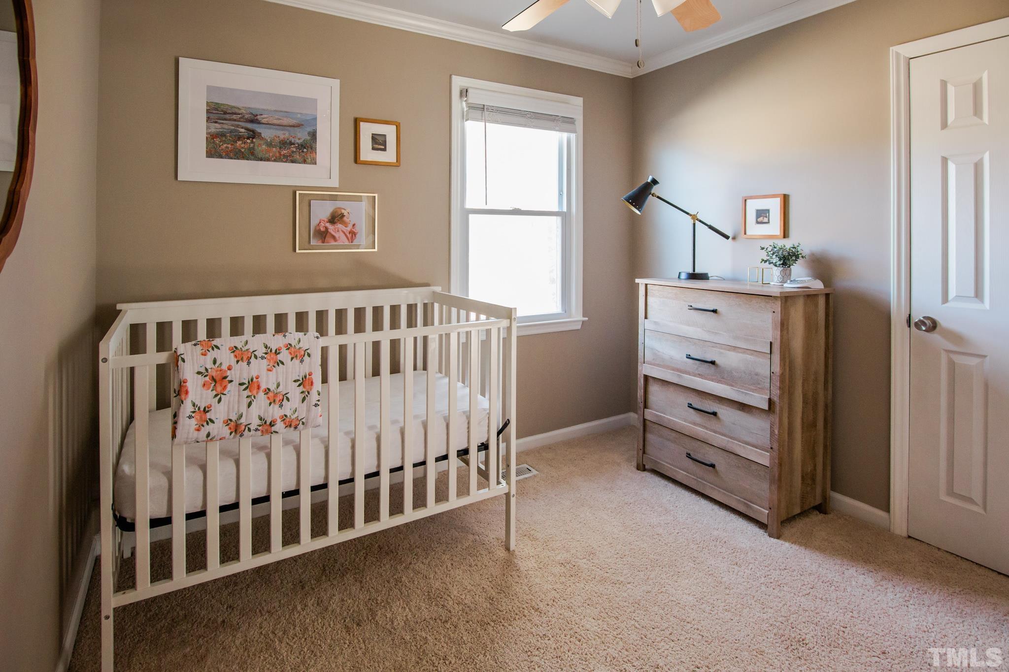 623 Little Creek Church Road Clayton, NC 27520 - Photo 25 of 47 a bedroom with furniture and a window
