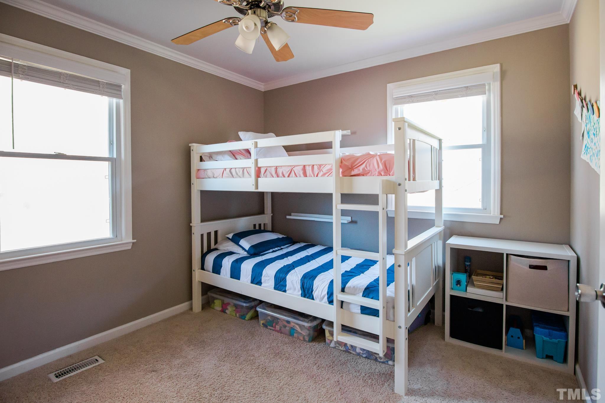 623 Little Creek Church Road Clayton, NC 27520 - Photo 26 of 47 a bedroom with furniture and a window