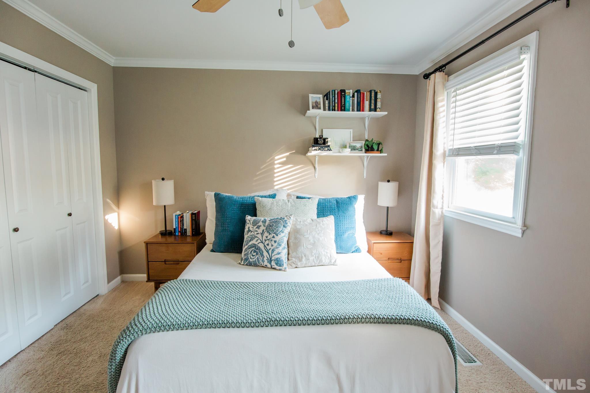 623 Little Creek Church Road Clayton, NC 27520 - Photo 29 of 47 a bedroom with a bed and a window