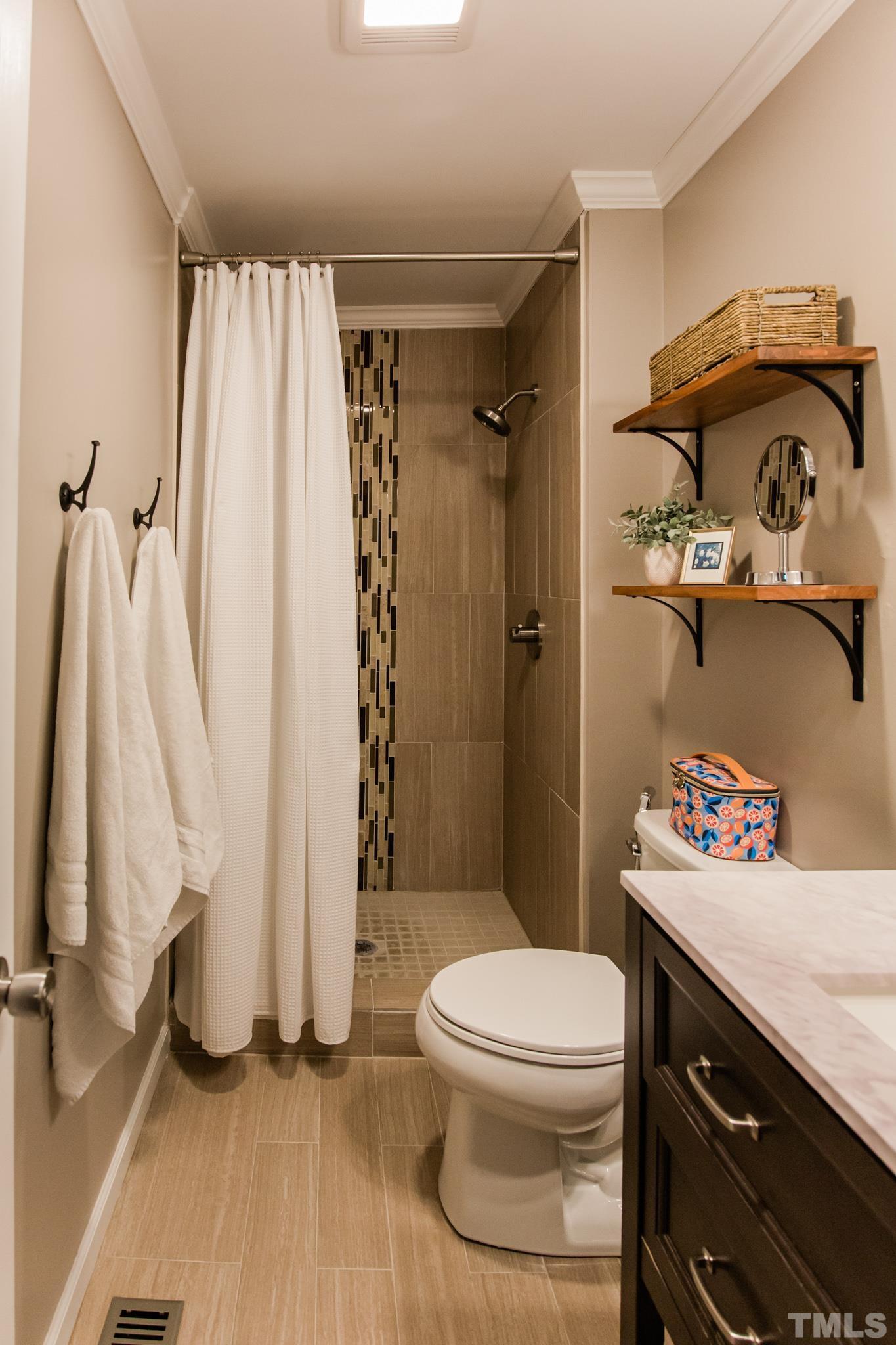 623 Little Creek Church Road Clayton, NC 27520 - Photo 39 of 47 a bathroom with a toilet and a shower