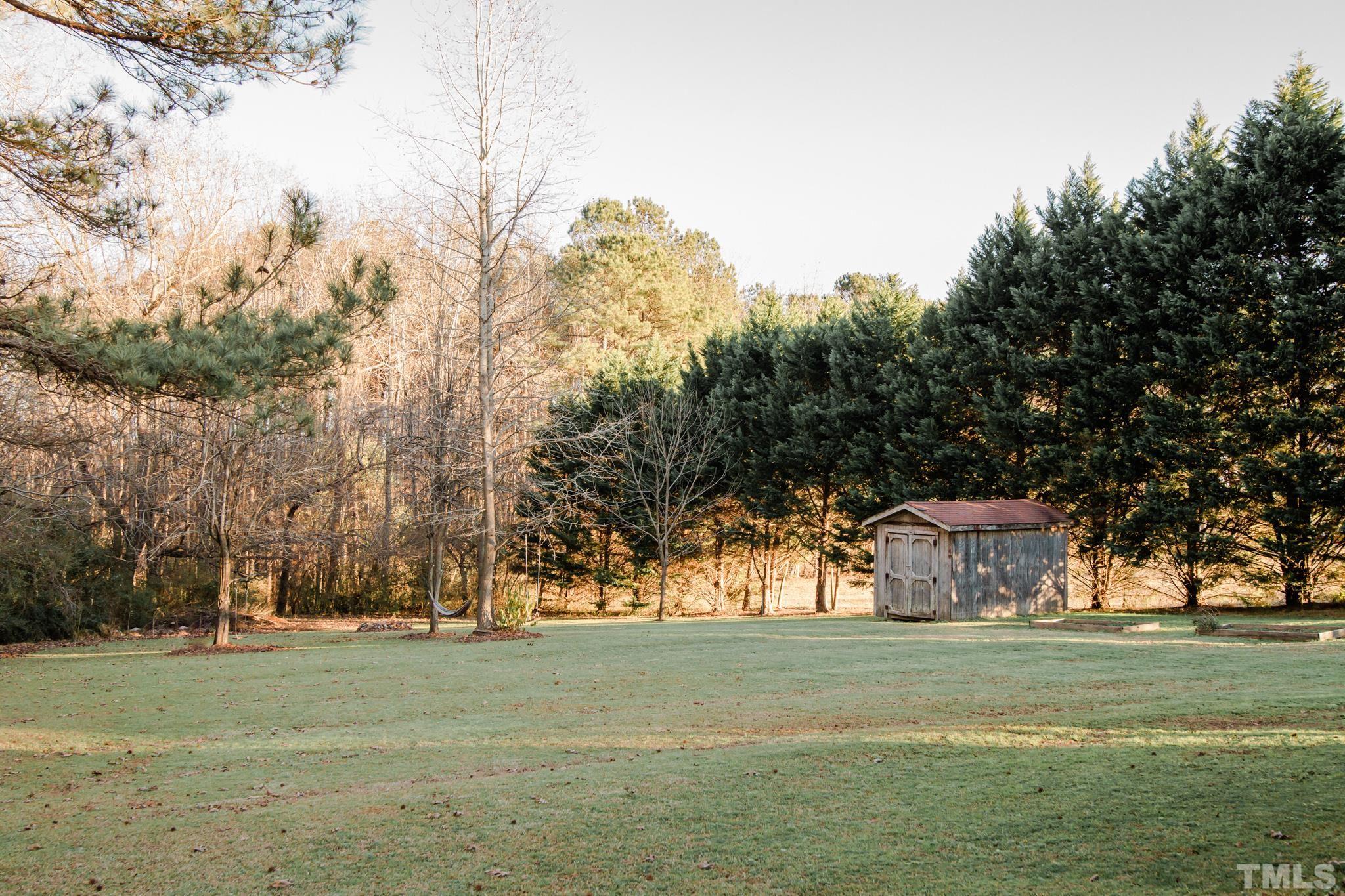 623 Little Creek Church Road Clayton, NC 27520 - Photo 44 of 47 a big yard with large trees
