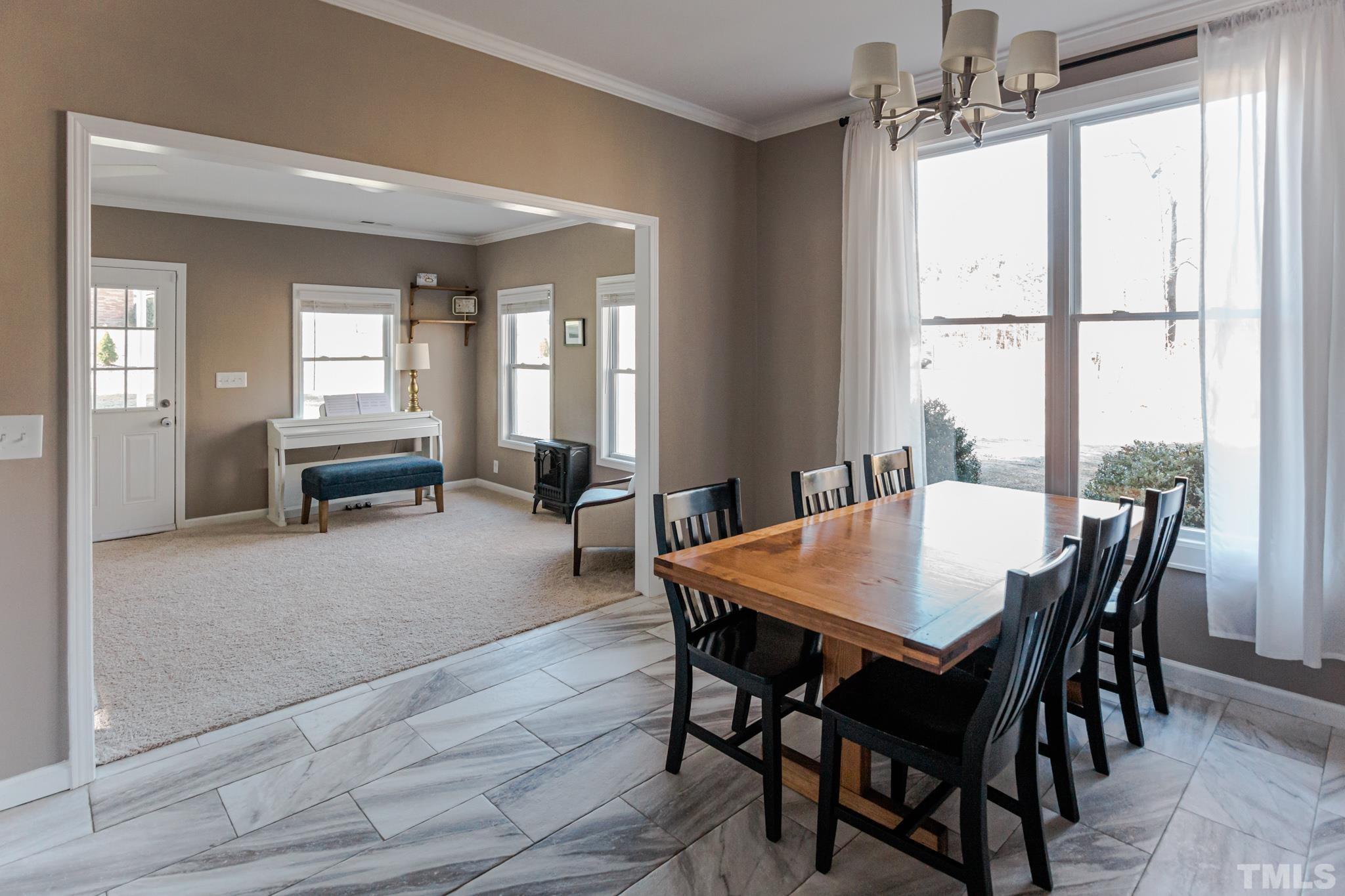 623 Little Creek Church Road Clayton, NC 27520 - Photo 7 of 47 a view of a dining room with furniture window and outside view