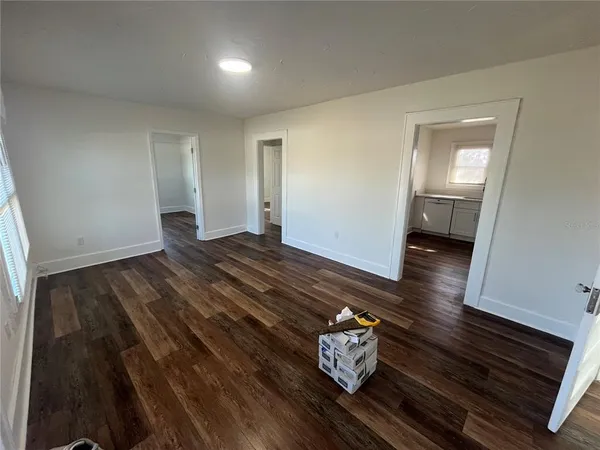 a view of room with wooden floor