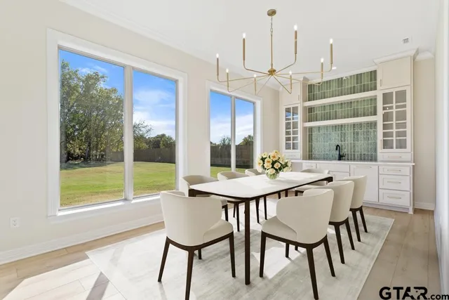 a view of a dining room with furniture window and outside view