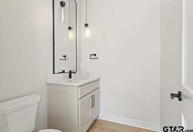 a bathroom with a sink and a toilet