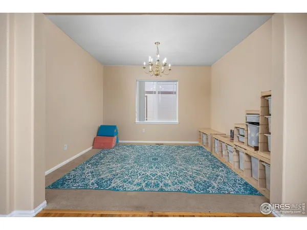 a living room with hard wood flooring