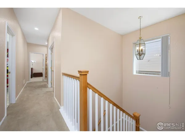 a view of a hallway with a white walls