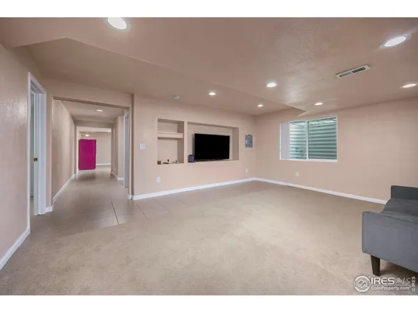 a view of an empty room with windows