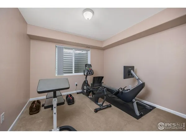 a work room with furniture and a window
