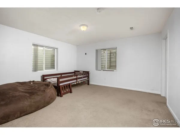 a bedroom with furniture and windows
