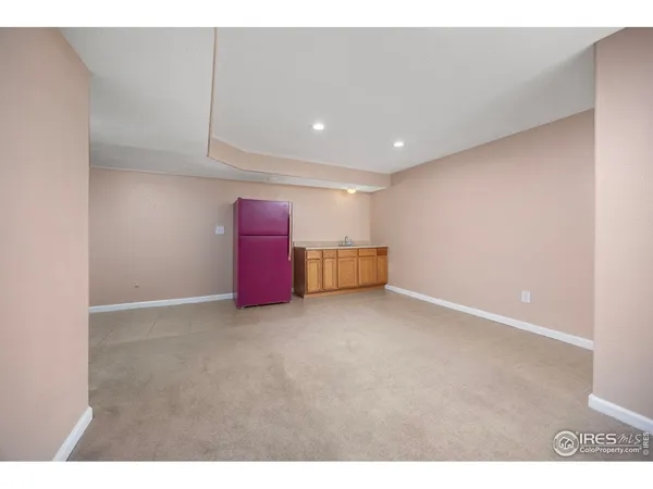 a view of backyard with table and chairs and potted plants