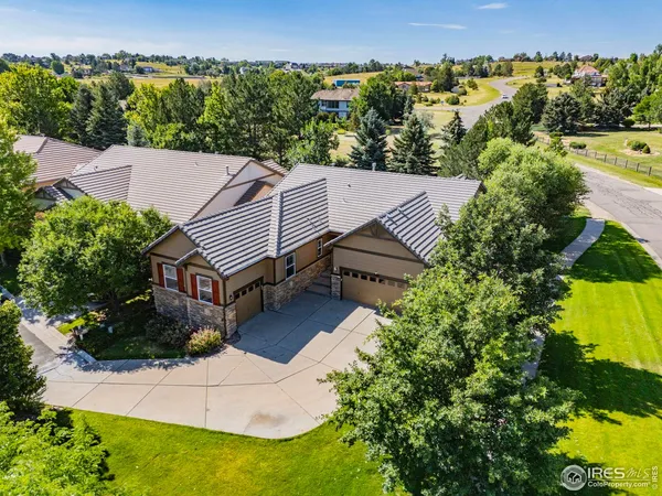 an aerial view of a house having yard