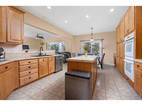 a kitchen with sink cabinets and window