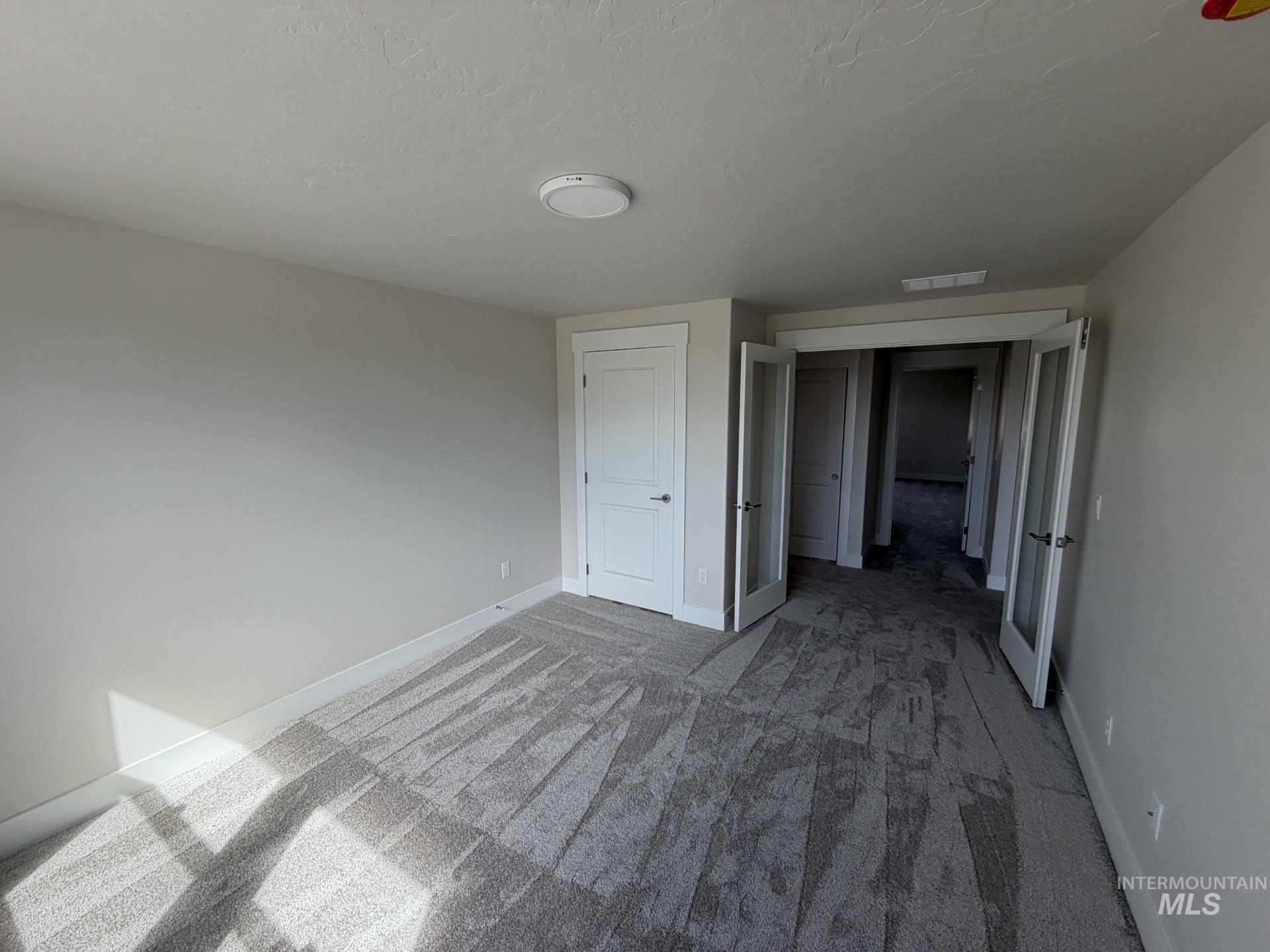 Tbd East Fitz Roy Street, Unit TALENT Kuna, ID 83634 - Photo 20 of 23 Unfurnished bedroom featuring baseboards and light carpet