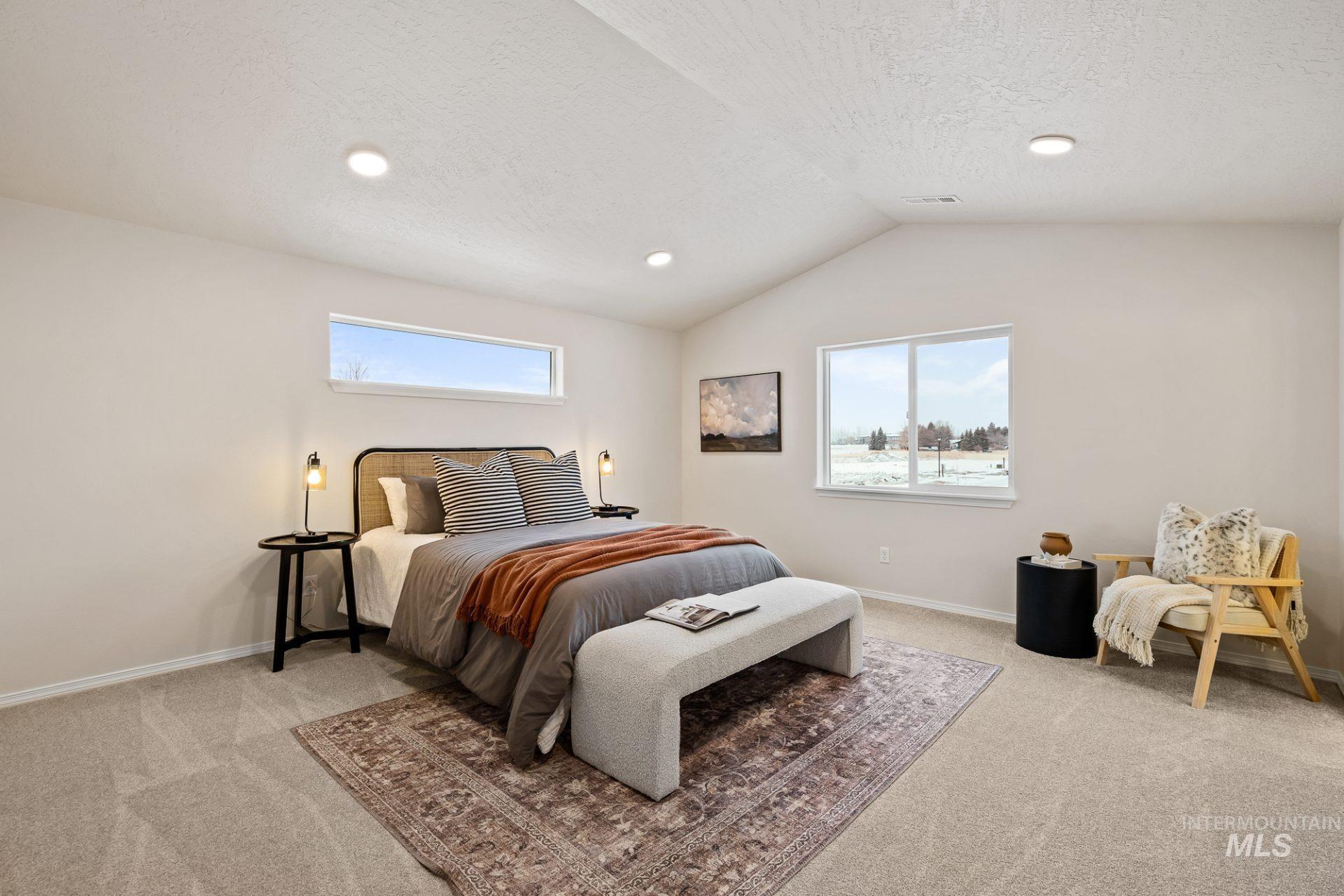 Tbd East Fitz Roy Street, Unit TALENT Kuna, ID 83634 - Photo 9 of 23 Bedroom featuring light colored carpet, multiple windows, a textured ceiling, and recessed lighting