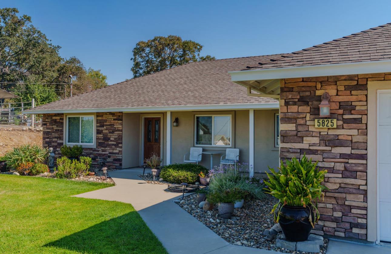 a front view of a house with a porch