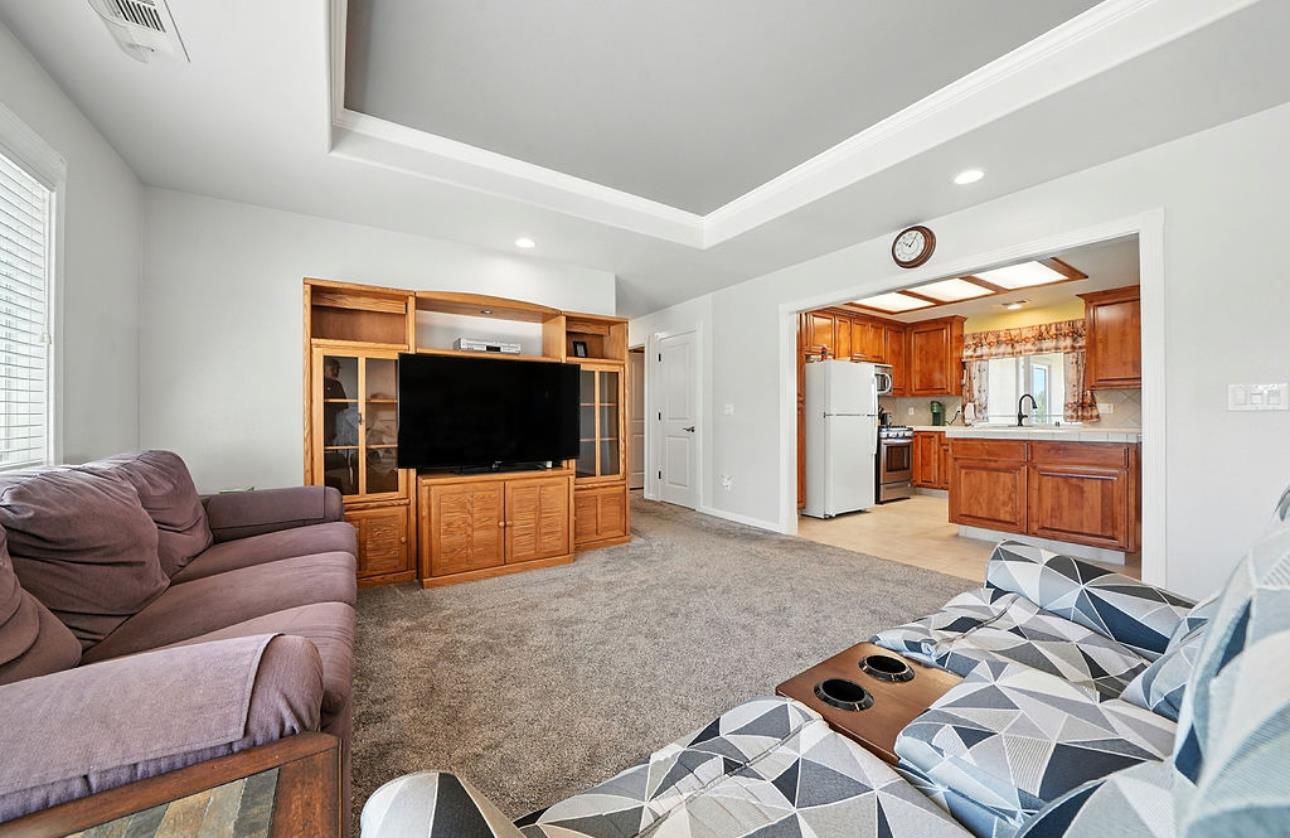 5825 Rippon Road Valley Springs, CA 95252 - Photo 11 of 45 a living room with furniture and a flat screen tv