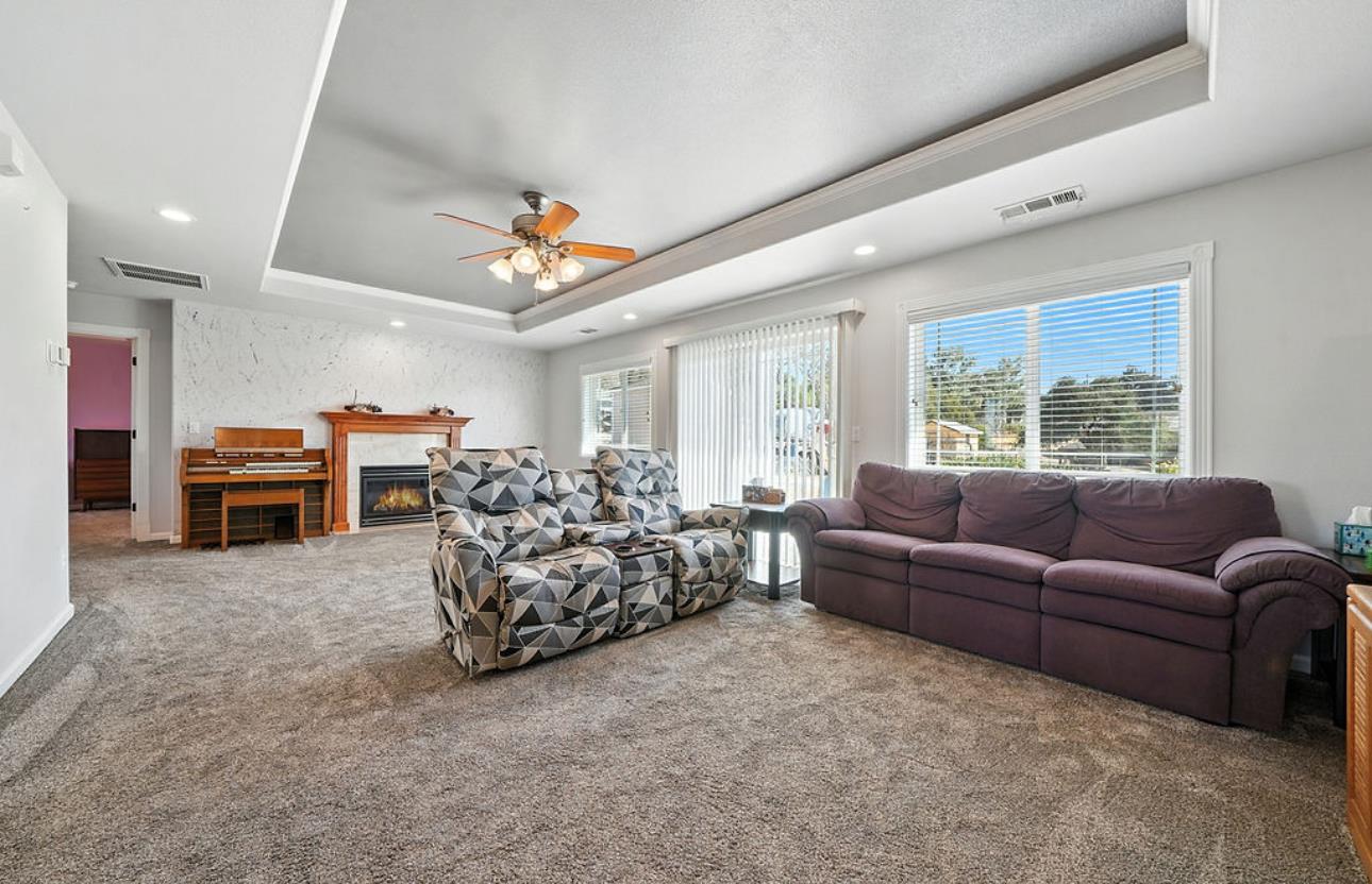 5825 Rippon Road Valley Springs, CA 95252 - Photo 14 of 45 a living room with furniture a air conditioner vent and a large window