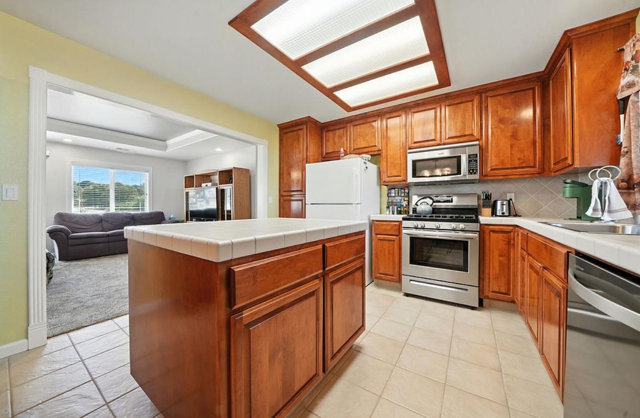 5825 Rippon Road Valley Springs, CA 95252 - Photo 17 of 45 a kitchen with stainless steel appliances granite countertop a stove and a sink