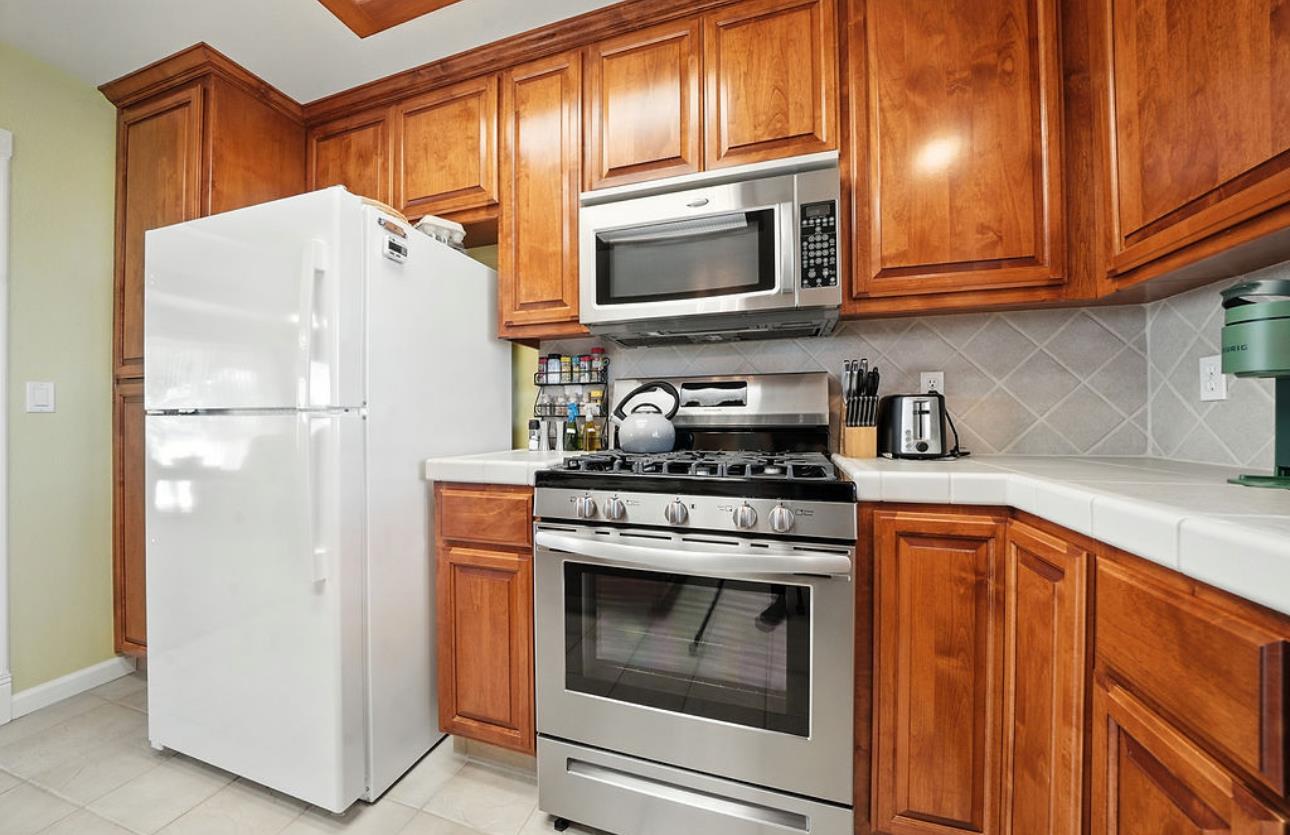 5825 Rippon Road Valley Springs, CA 95252 - Photo 18 of 45 a kitchen with stainless steel appliances granite countertop a refrigerator stove and microwave