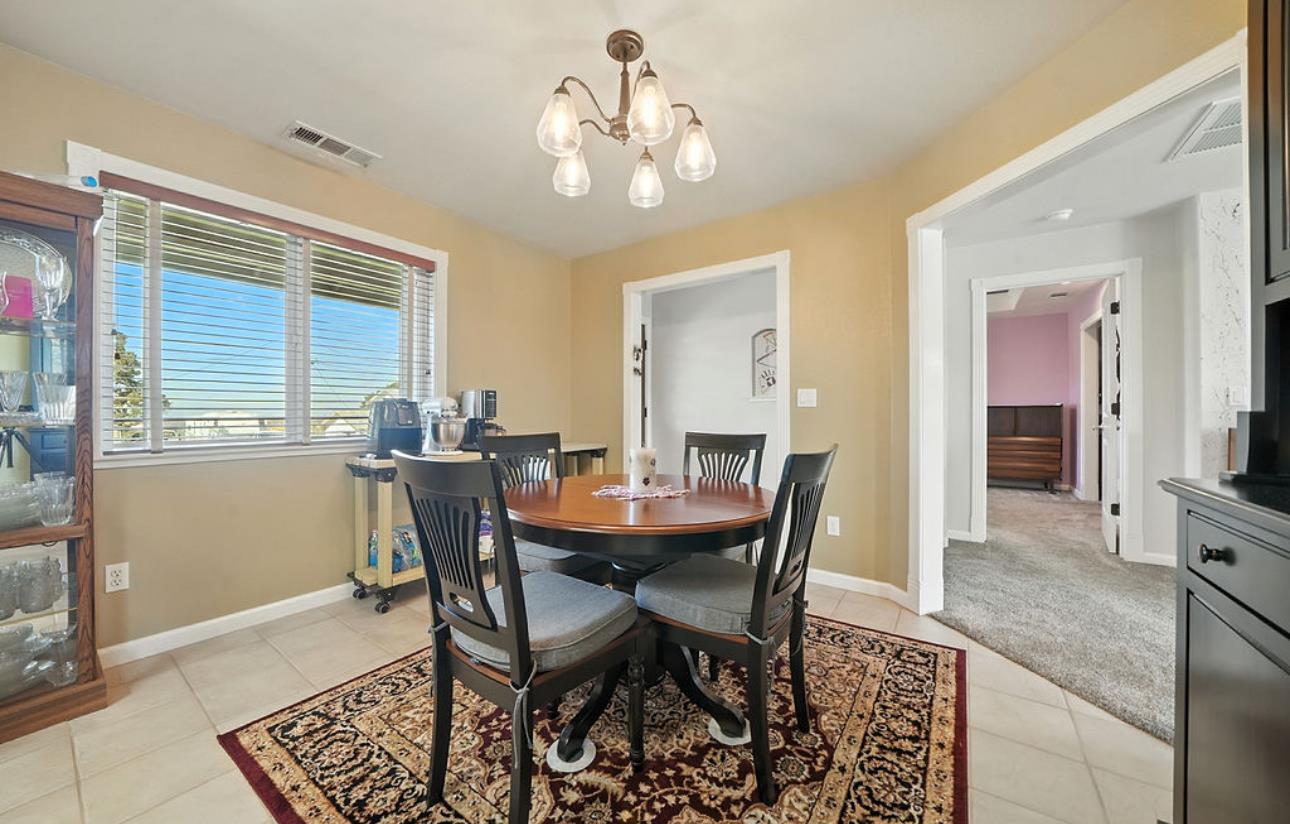 5825 Rippon Road Valley Springs, CA 95252 - Photo 20 of 45 a view of a dining room with furniture and chandelier