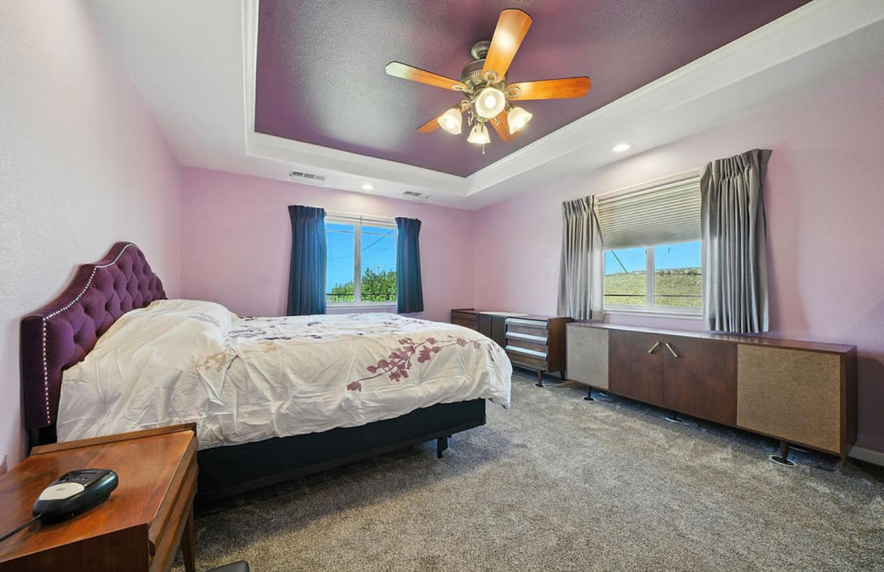 5825 Rippon Road Valley Springs, CA 95252 - Photo 25 of 45 a bed sitting in a bedroom next to a window