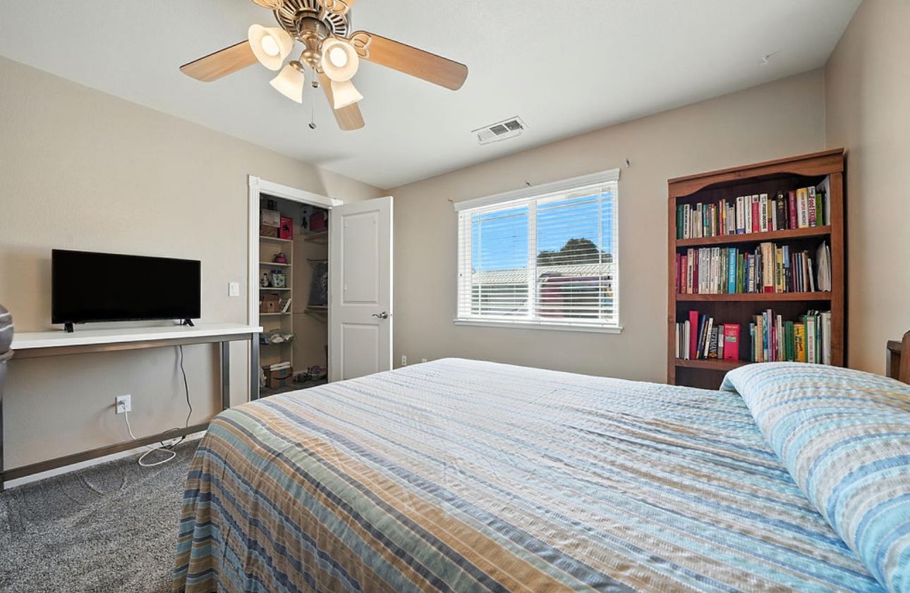 5825 Rippon Road Valley Springs, CA 95252 - Photo 32 of 45 a bedroom with a bed and a flat screen tv