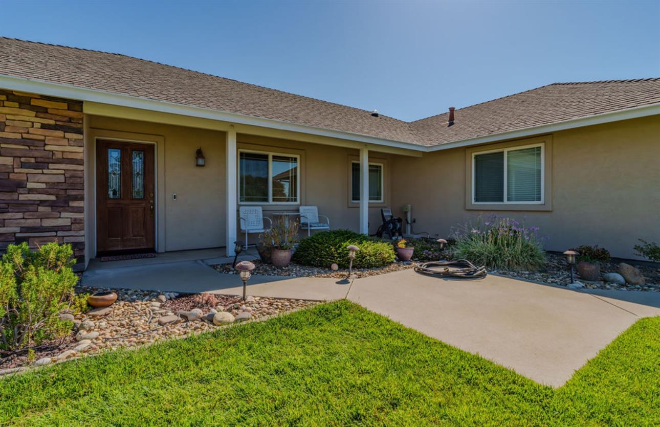 5825 Rippon Road Valley Springs, CA 95252 - Photo 4 of 45 a view of a patio with table and chairs in front of house