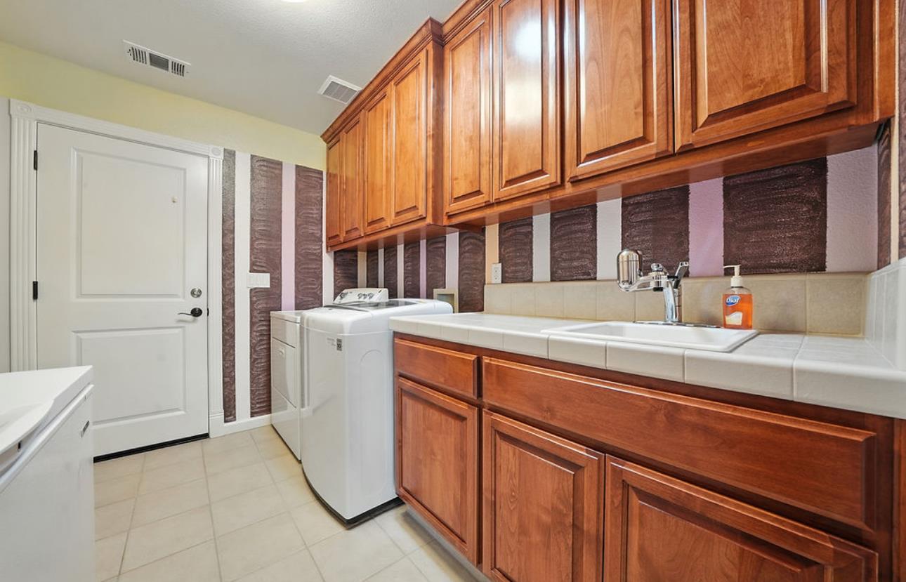 5825 Rippon Road Valley Springs, CA 95252 - Photo 45 of 45 a kitchen with stainless steel appliances a sink and cabinets