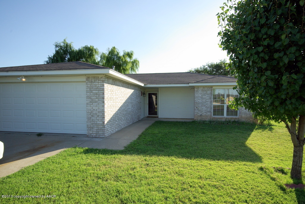 5200 Capulin Lane Amarillo, TX 79110 - Photo 1 of 8 a view of backyard with a garden and plants